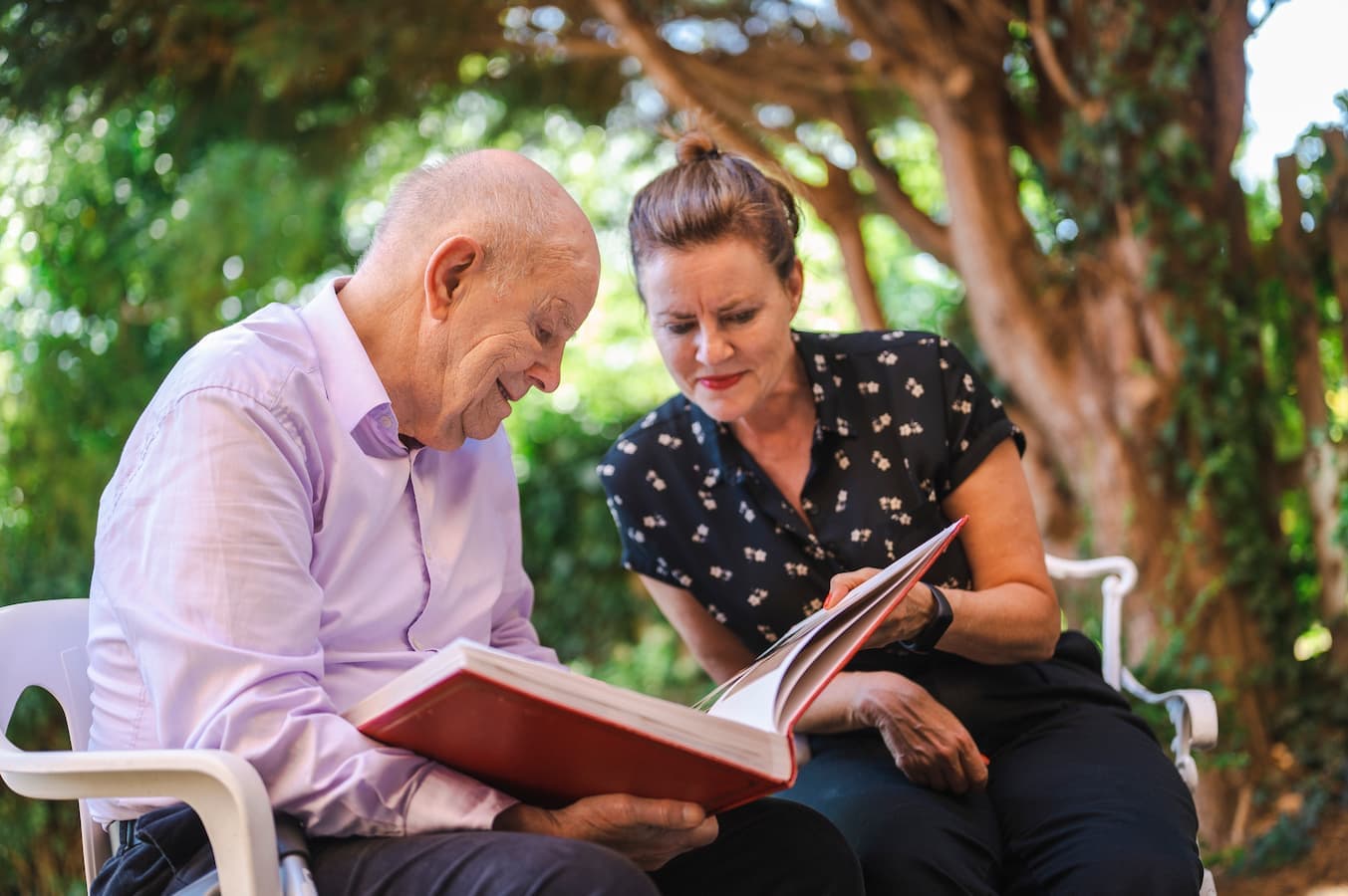 Carer providing compassionate home care to an elderly person